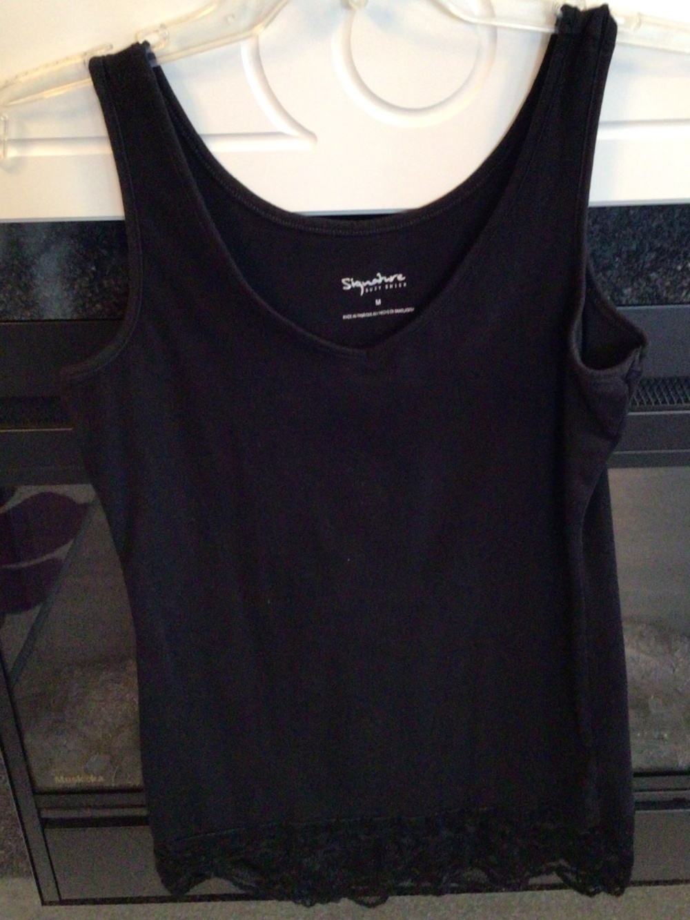 5/$25.00 Women’s Black goth v neck tank with lace size medium in good condition